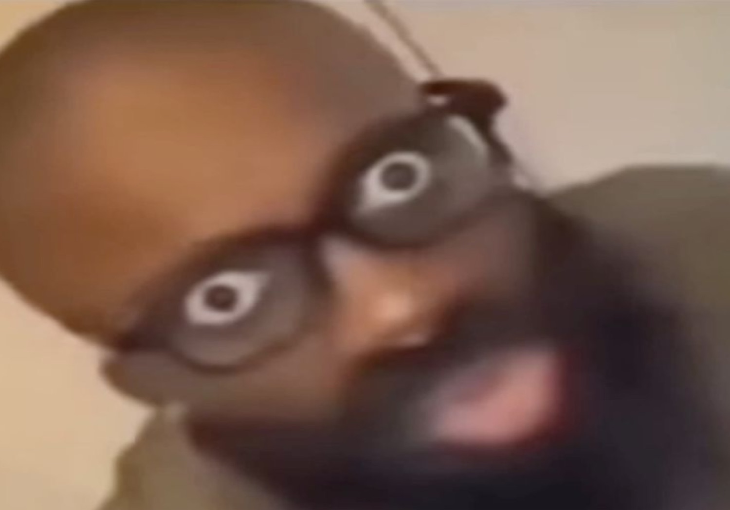 Man with cartoon bug-eyes staring into the camera in pure wide-eyed disbelief