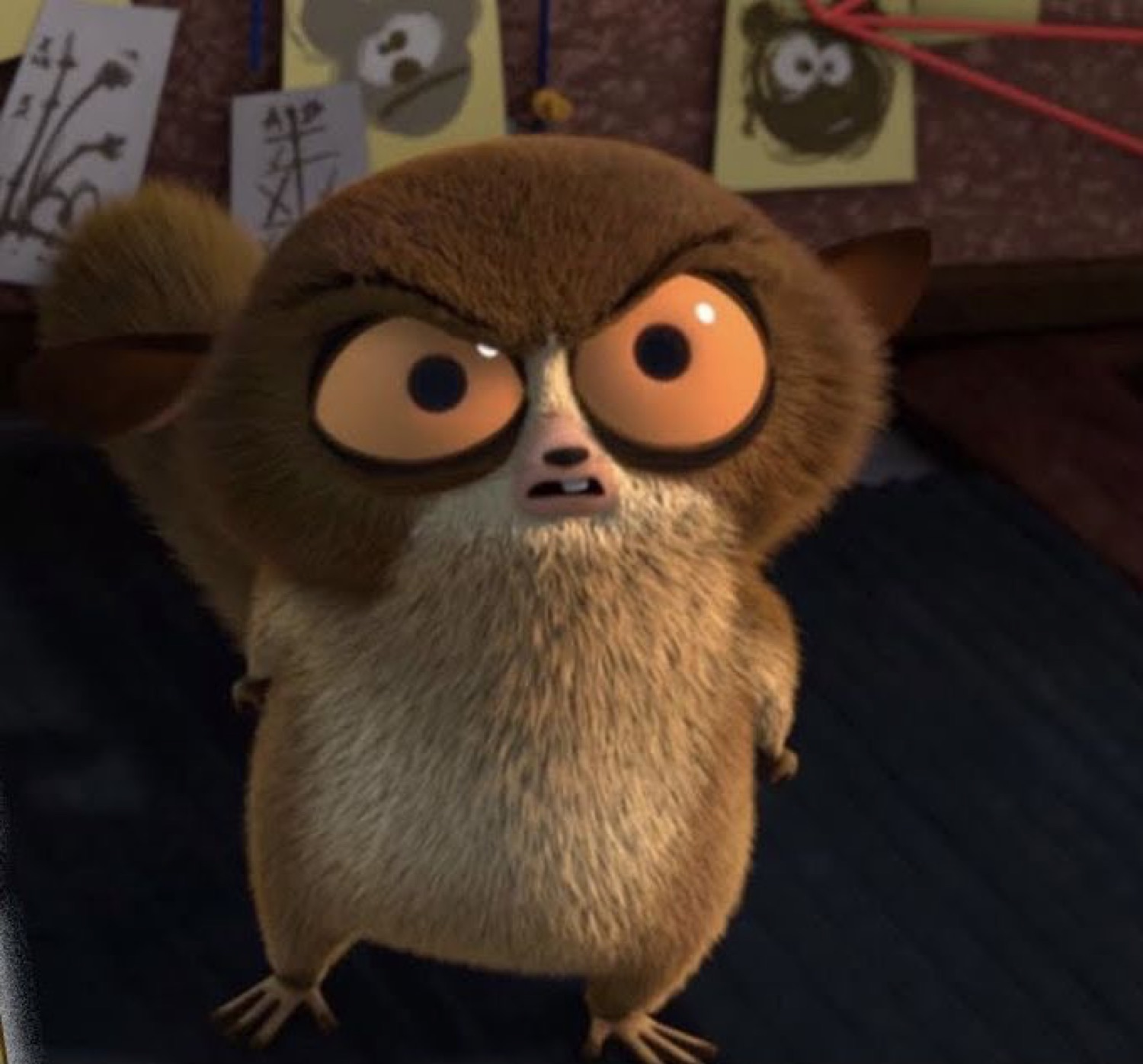 Furry big-eyed lemur cartoon glaring with a tiny furious scowl
