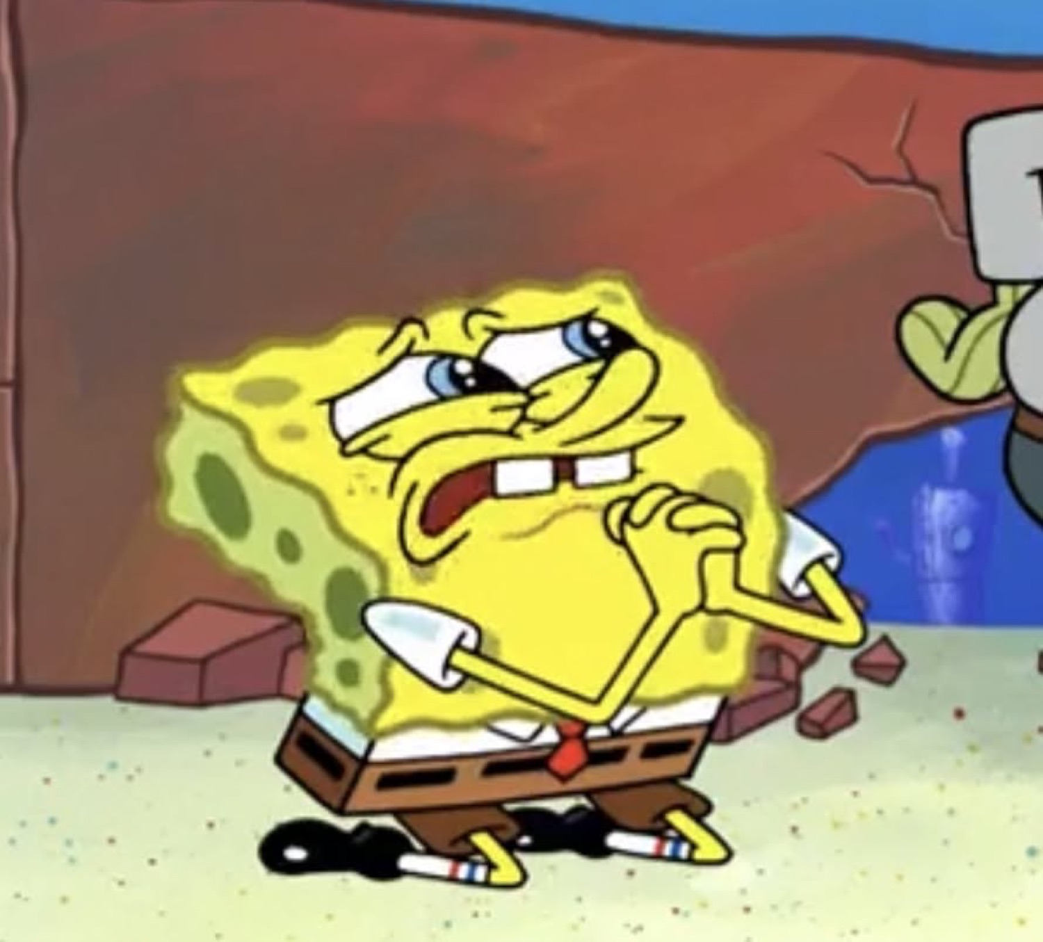SpongeBob looking absolutely furious and tense, glowing yellow with a shovel in hand