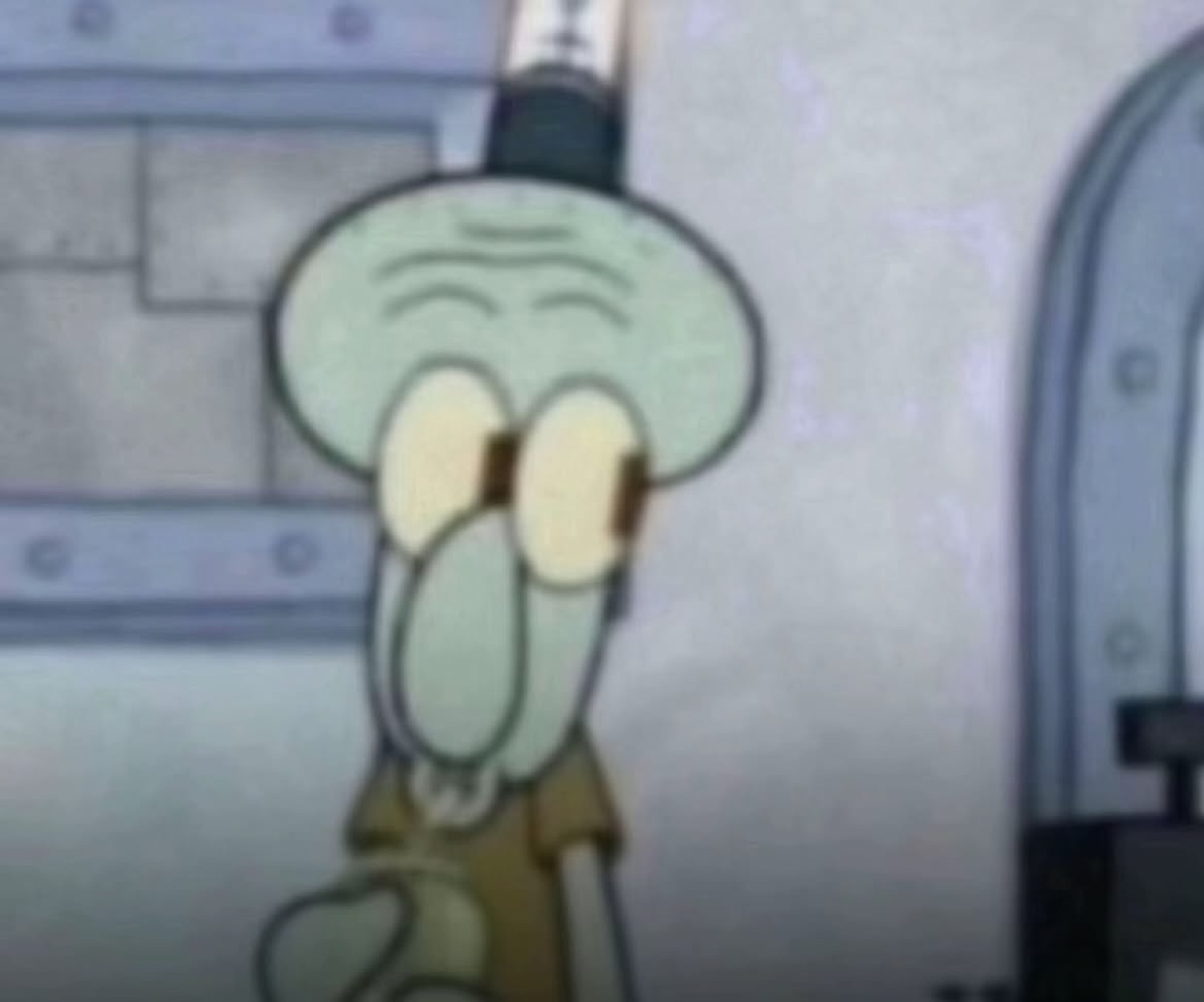 Squidward staring straight ahead with a flat, thoroughly unimpressed frown