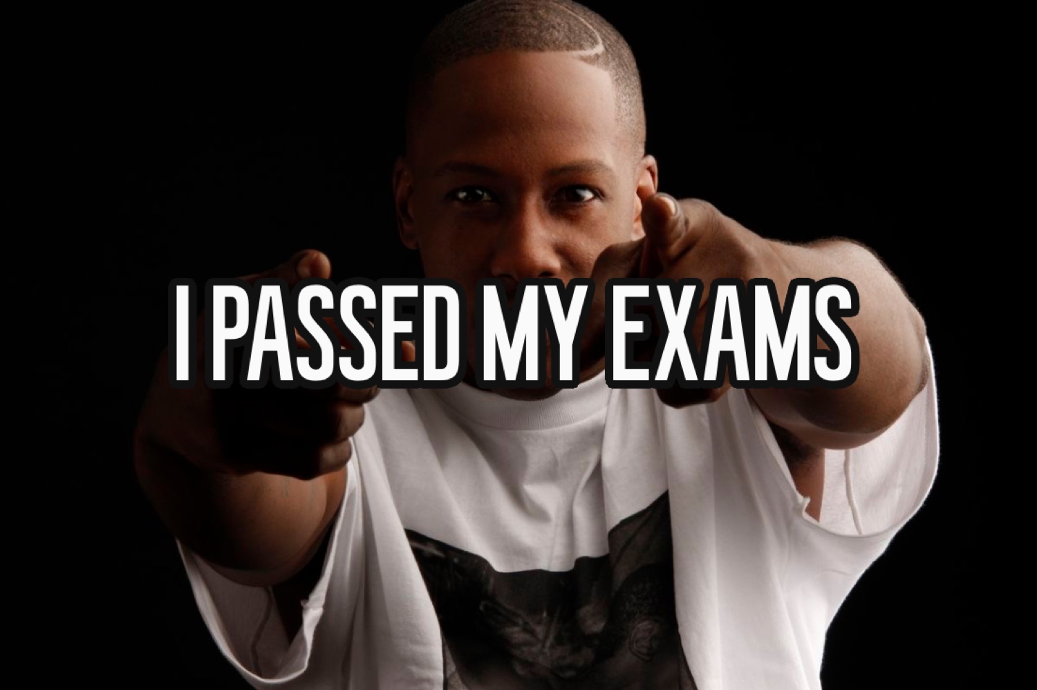 Man pointing at the camera: 'I PASSED MY EXAMS'