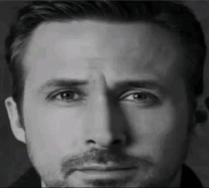 Ryan Gosling in black and white, staring you down with quiet intensity