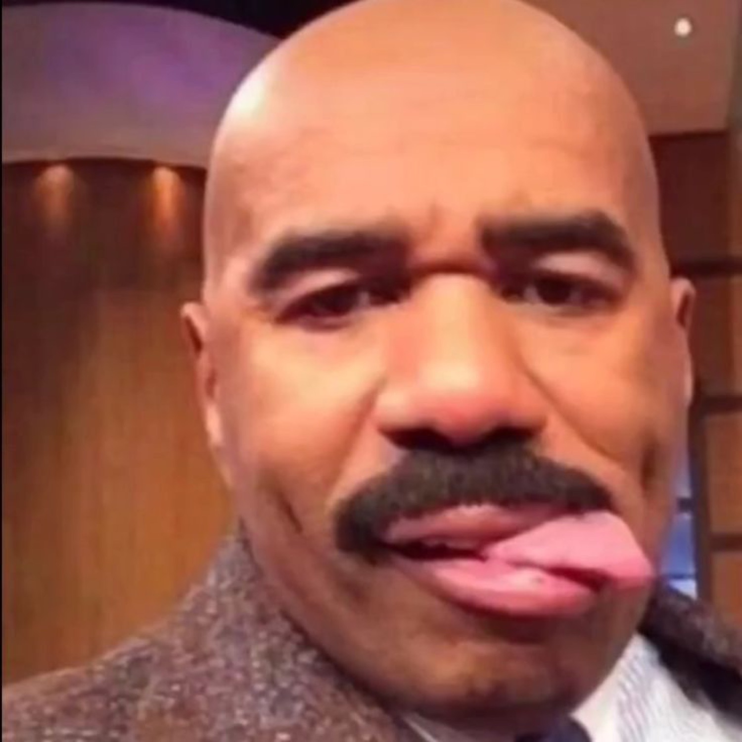 Steve Harvey sticking his tongue out