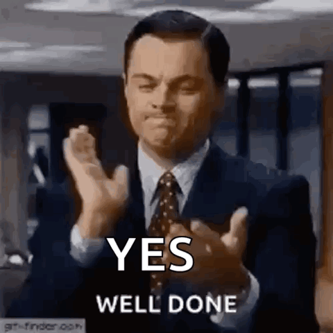 Leonardo DiCaprio in a suit nodding and clapping, "Yes, well done"