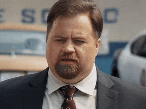 Man in a suit squinting, "You must have made some kind of impression last night"