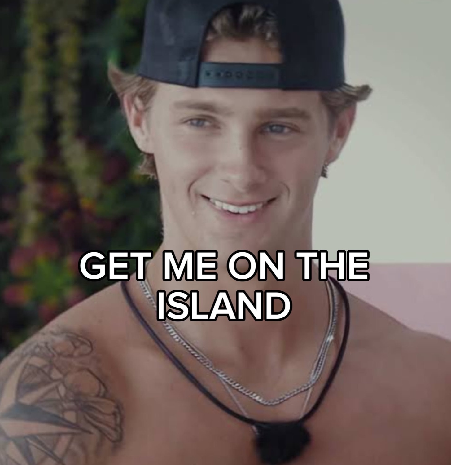 Love Island islander grinning under 'GET ME ON THE ISLAND'