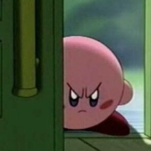 Kirby peeking around a doorway with an angry, glaring scowl