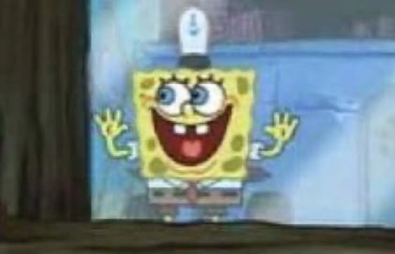SpongeBob grinning wide with jazz hands, absolutely losing it with joy