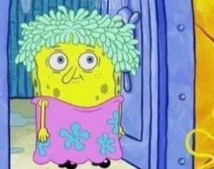 SpongeBob in a pink dress and wild wet hair looking bewildered and frumpy