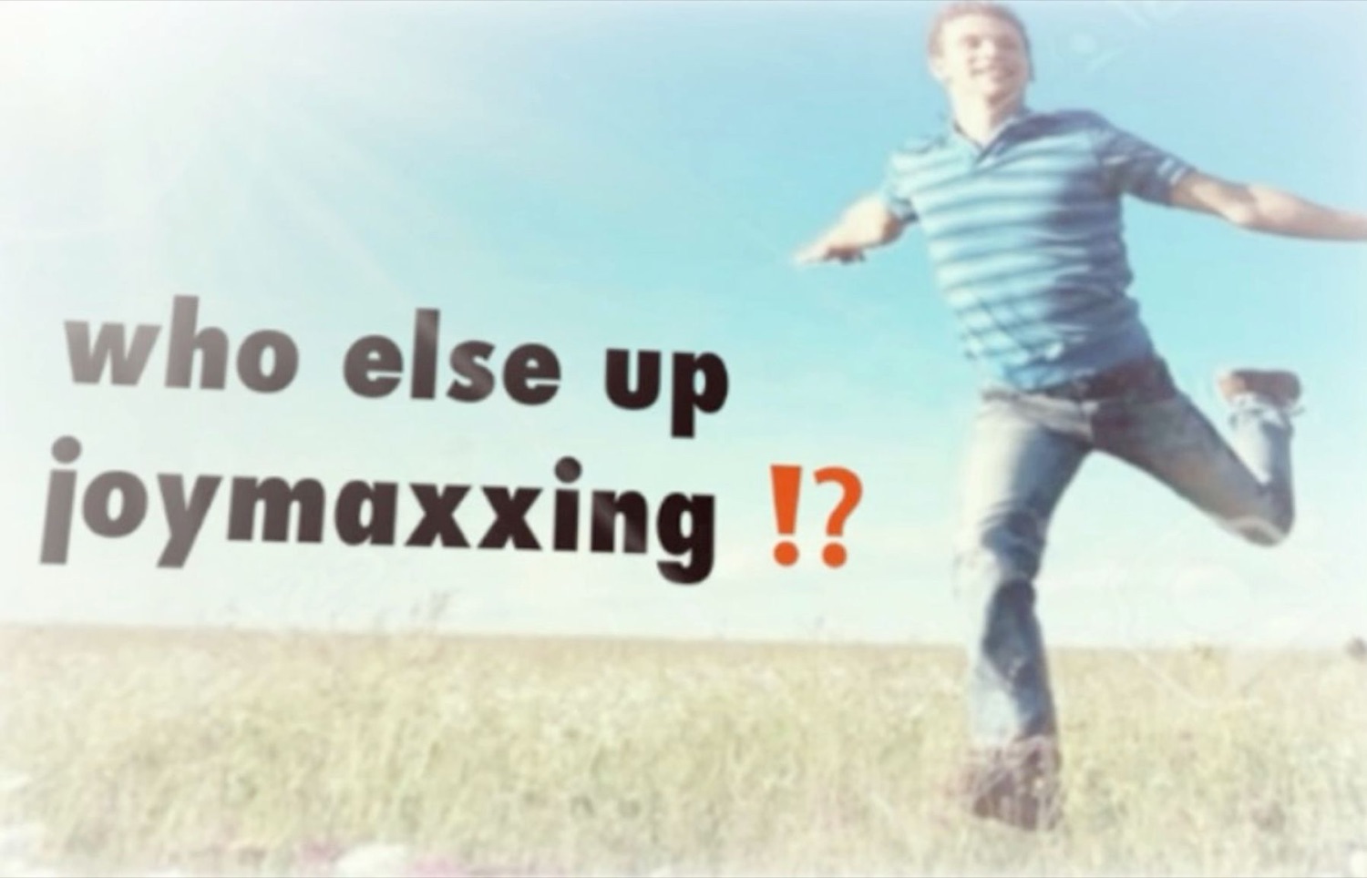 Stock-photo man leaping through a field, captioned 'who else up joymaxxing ⁉️'