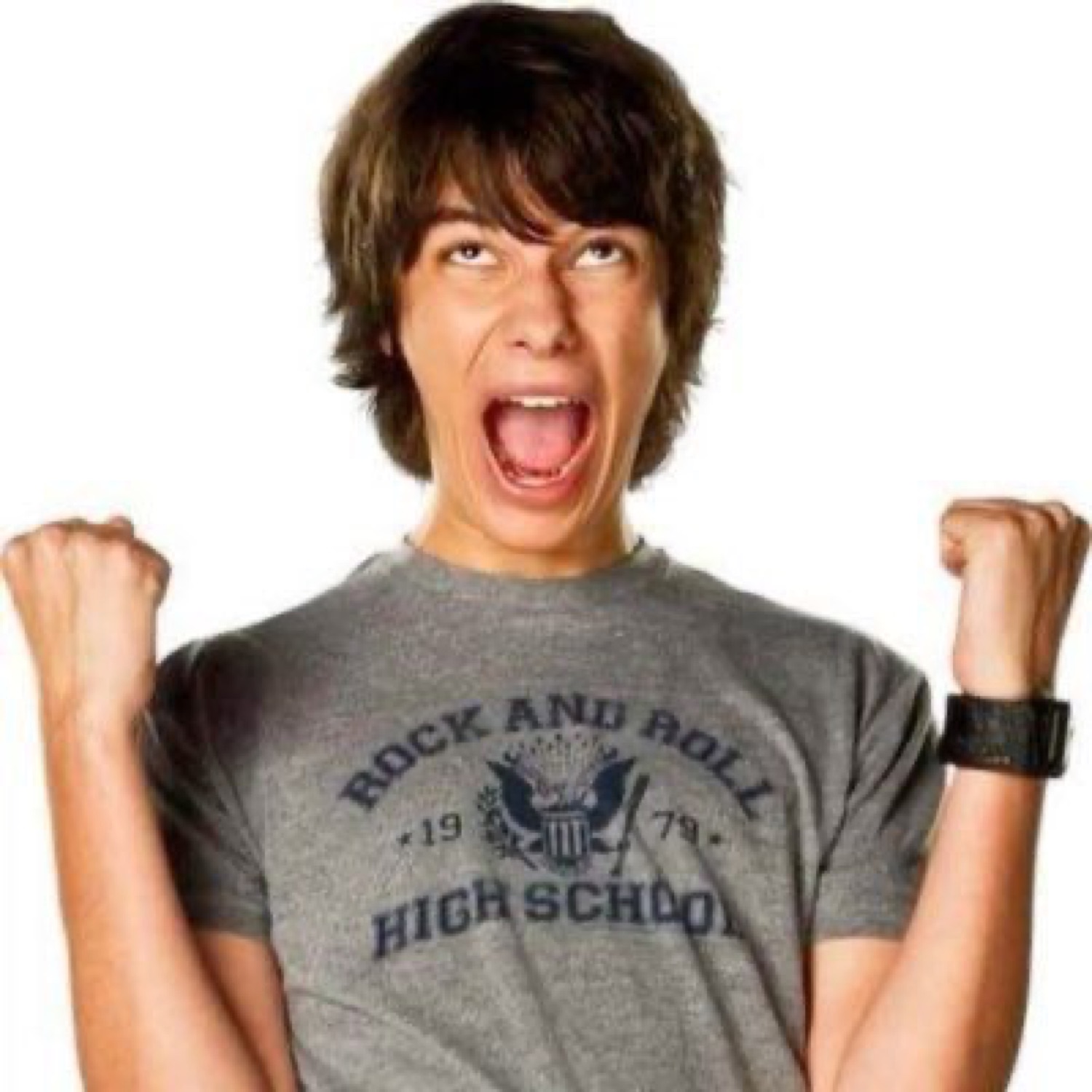 Teen boy in a Rock and Roll High School shirt pumping both fists and screaming with joy