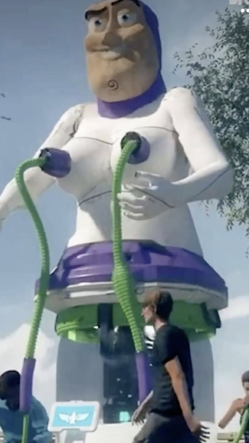 Giant Buzz Lightyear balloon or float towering over onlookers outdoors with arms outstretched