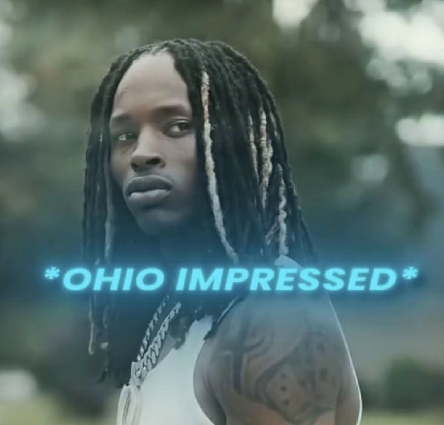 Guy with dreads glancing back deadpan, captioned '*OHIO IMPRESSED*'