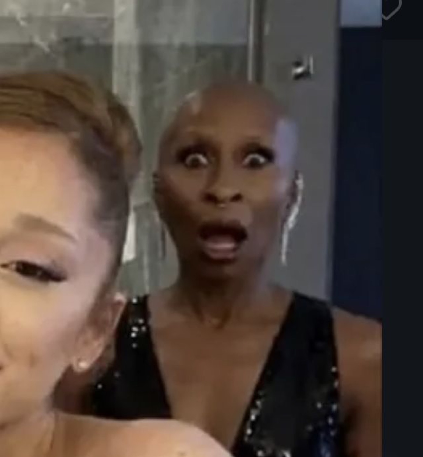 Cynthia Erivo's jaw hits the floor behind an unbothered Ariana Grande selfie