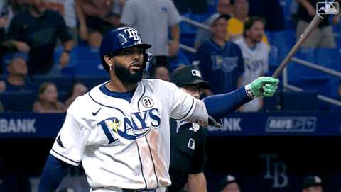 Tampa Bay Rays player celebrating and pointing after crossing home plate