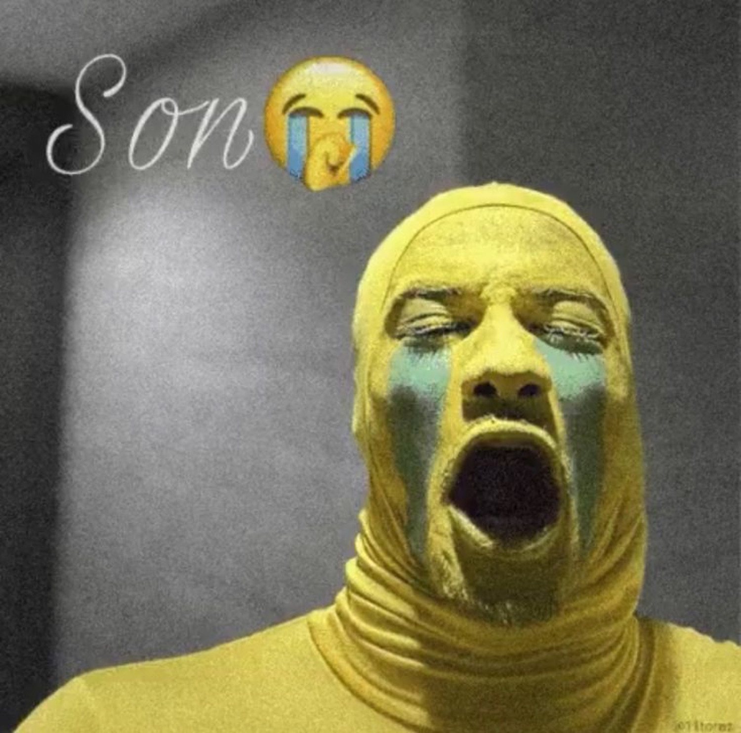 Man in a yellow bodysuit wailing with painted tears, captioned 'Son' plus crying emoji