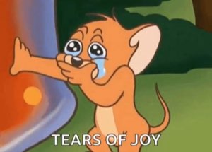 Jerry the mouse sobbing into a stack of pancakes captioned 'TEARS OF JOY'