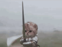 Kitten in knight armor holding a sword up in a windy field