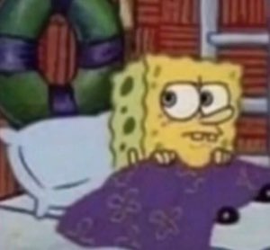 SpongeBob tucked in bed under a blanket with a tired, unimpressed stare