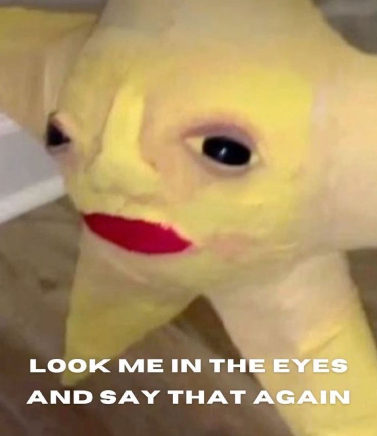A cursed yellow star plush with red lips captioned 'LOOK ME IN THE EYES AND SAY THAT AGAIN'