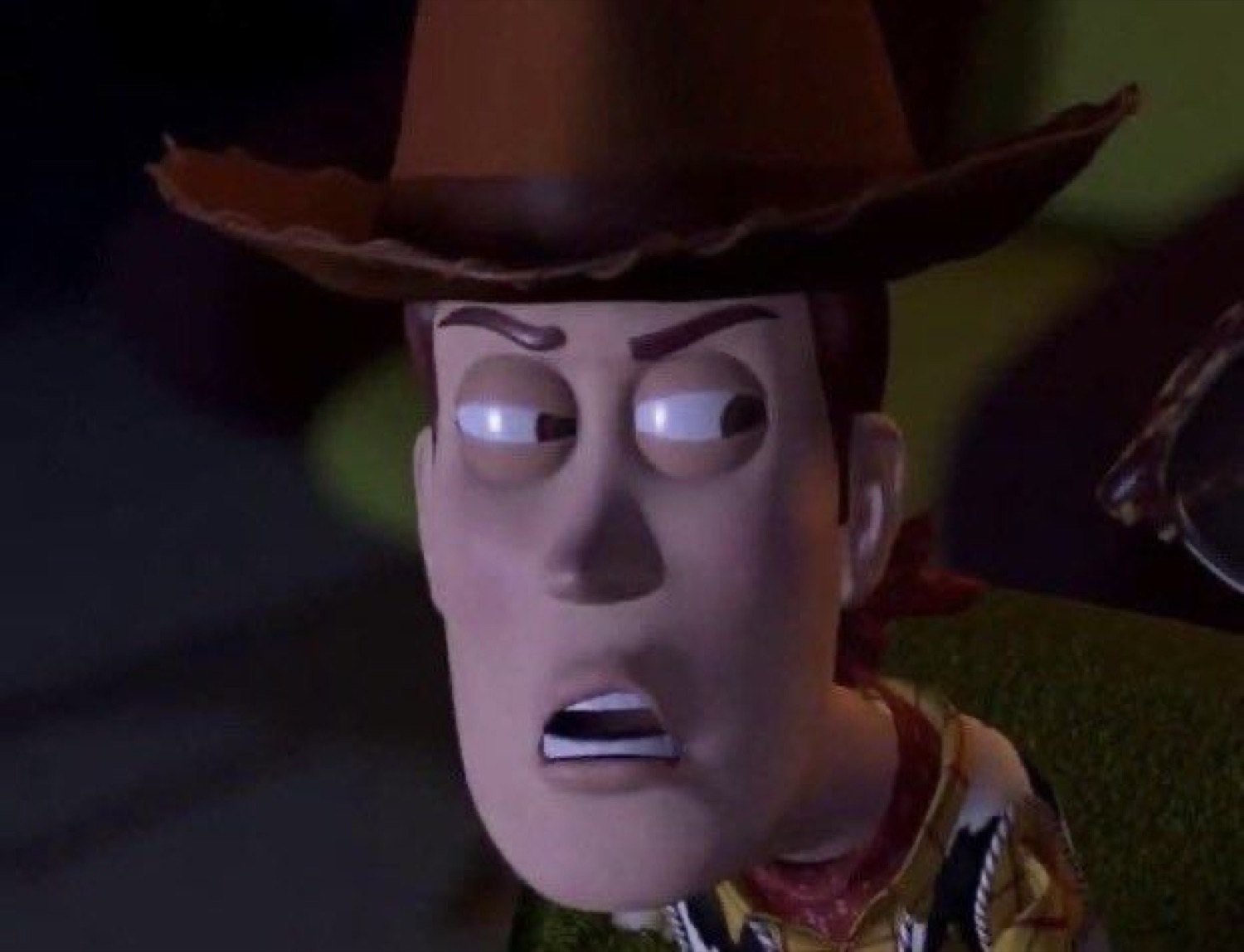 Woody from Toy Story with a wide-eyed, alarmed and confused stare