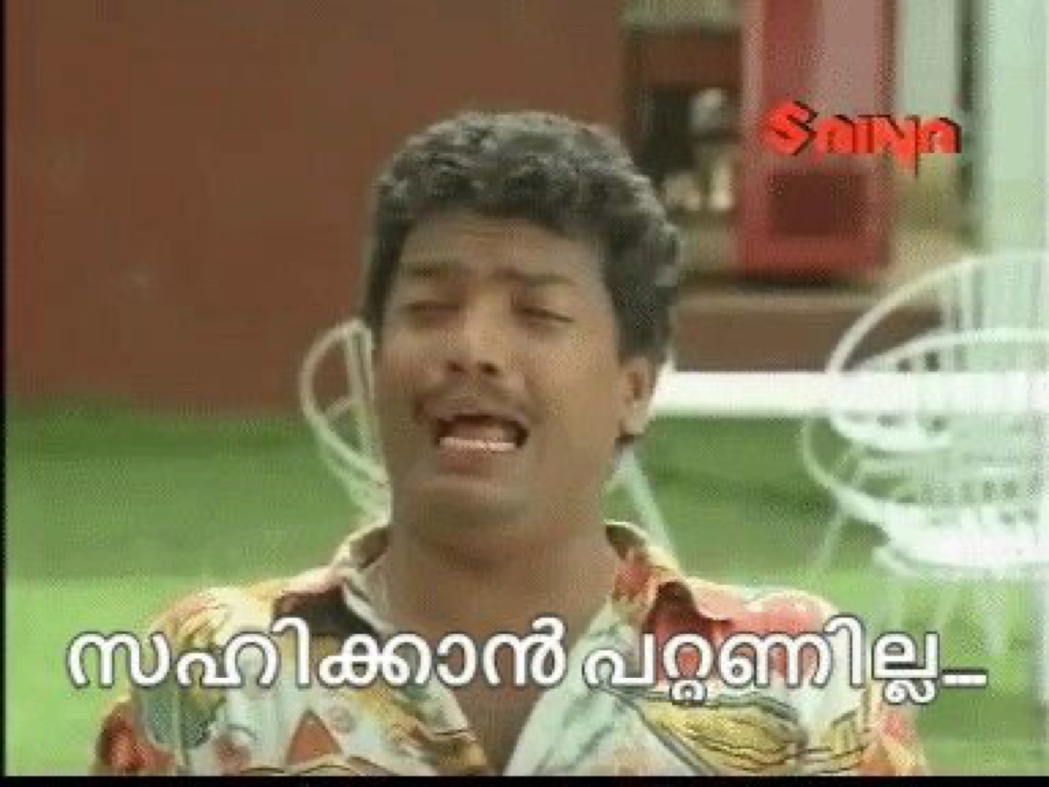 Man wincing in pain: 'സഹിക്കാൻ പറ്റുന്നില്ല' (I can't bear it)