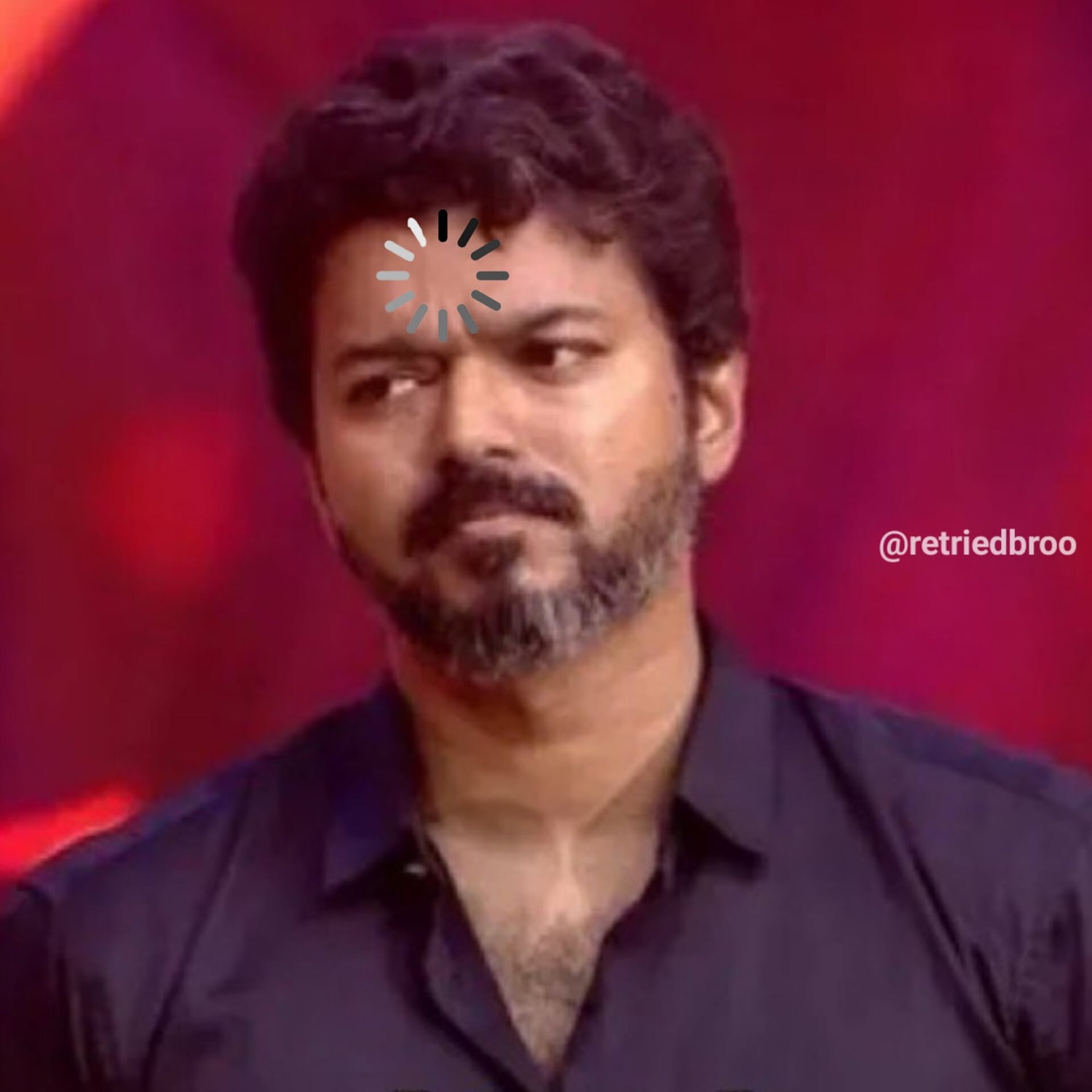 Vijay with a loading spinner on his forehead looking sideways