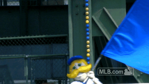 Bernie Brewer waving a big Brewers flag at the ballpark