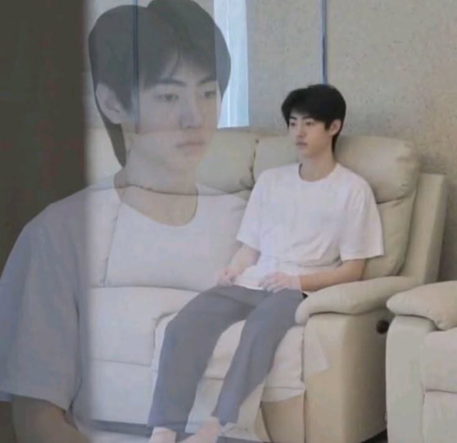 Guy slumped in a recliner staring off, a ghostly double of himself fading in beside him
