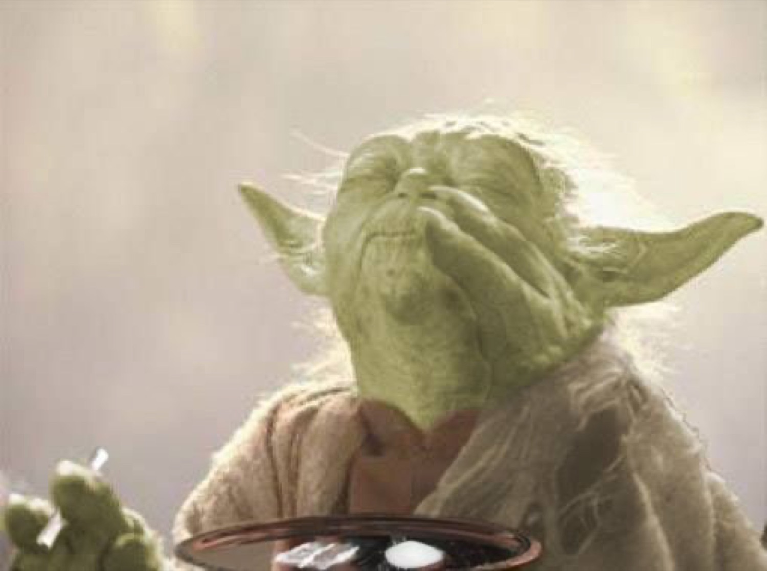 Yoda with his eyes closed, calmly meditating