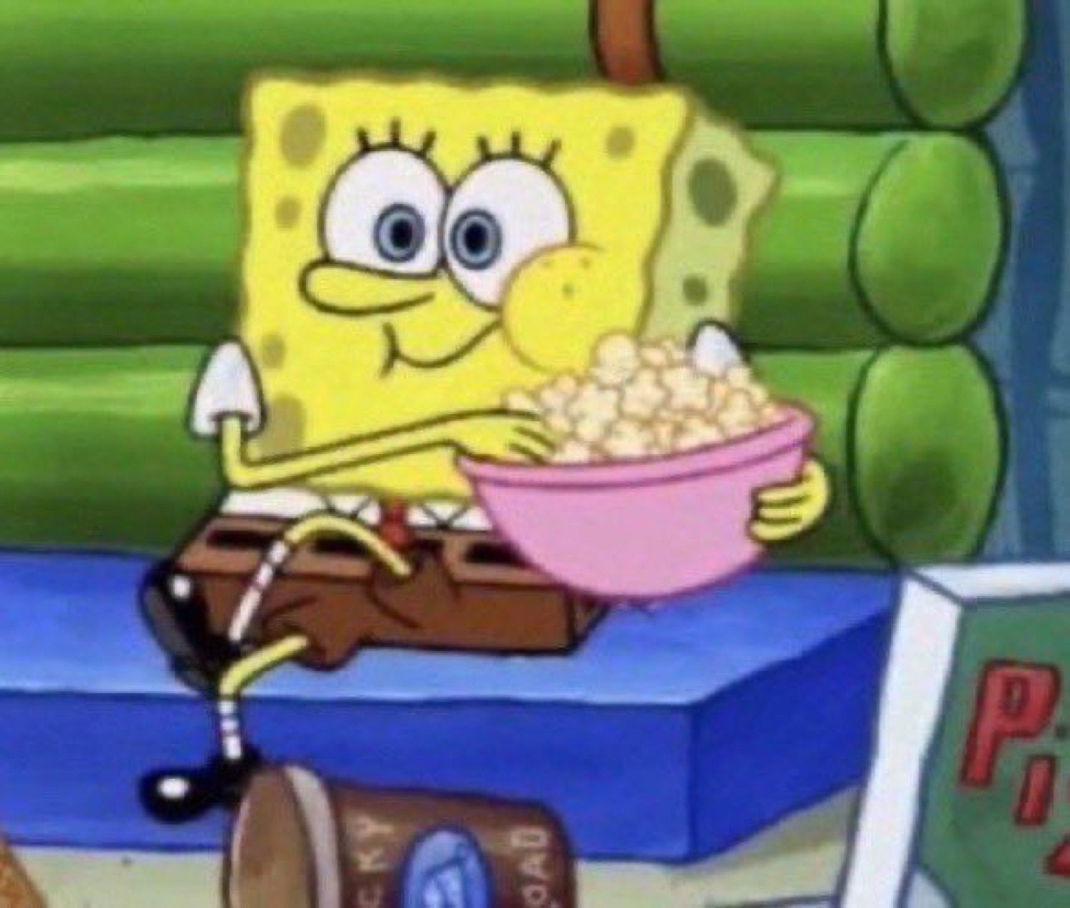 SpongeBob settling in with a big pink bowl of popcorn, ready for the show