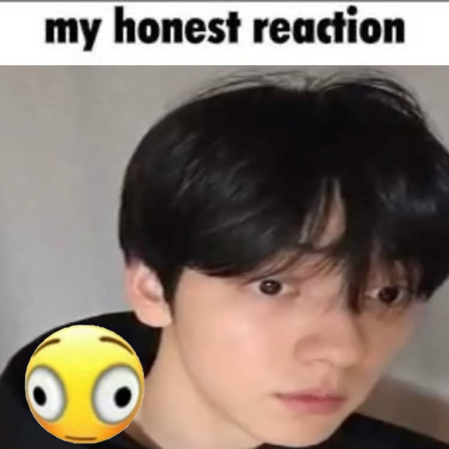 Young man staring flatly with a flushed emoji, captioned 'my honest reaction'