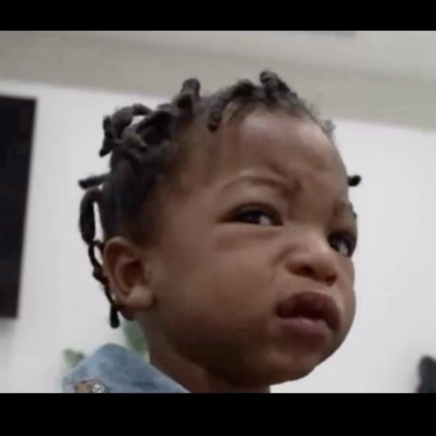 Toddler scowling with a scrunched, thoroughly disgusted face