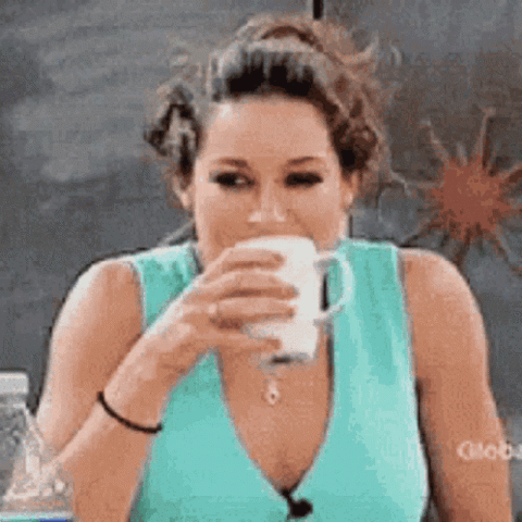 Woman spitting out her drink laughing