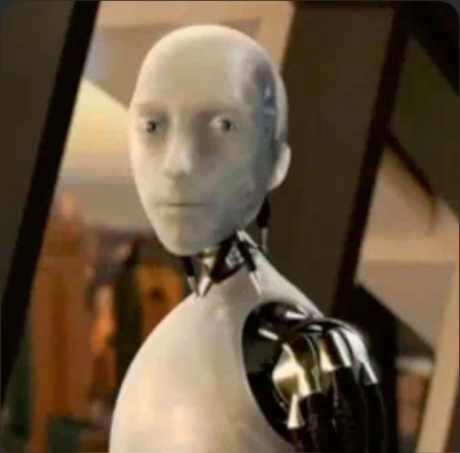 White humanoid robot turning to the camera with a blank, unsettling deadpan stare