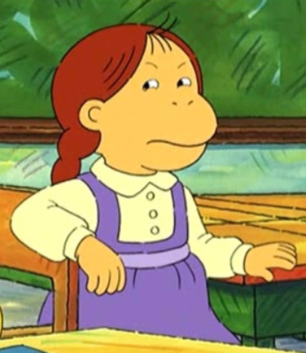 Arthur's sister D.W. sitting at a desk with a flat, quietly displeased expression
