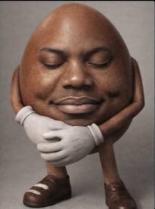 Egg-bodied character resting its chin on gloved hands with a smug, blissful smile