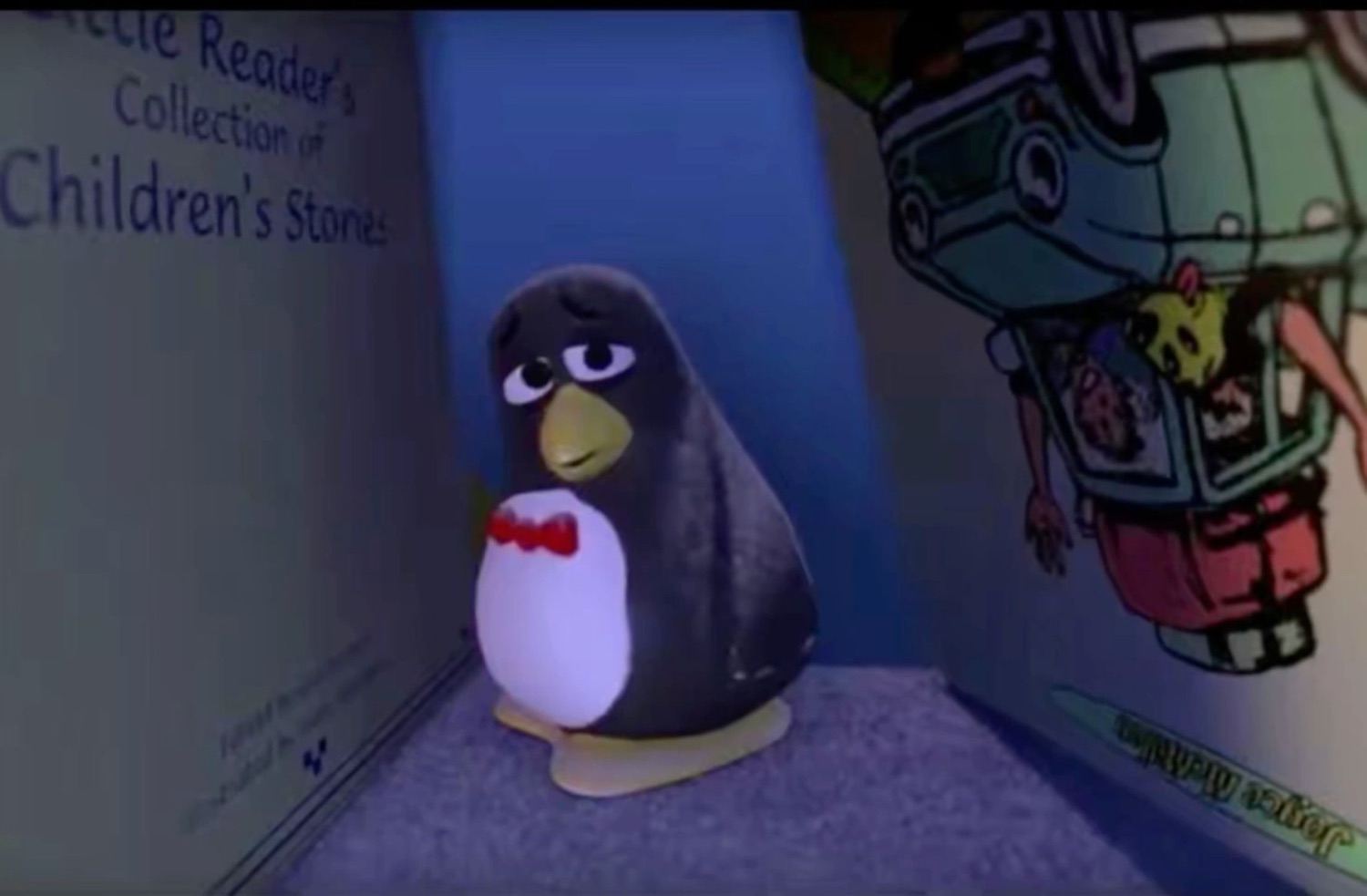 Sad plastic penguin toy with droopy eyes and a bow tie sitting alone among books