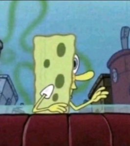 SpongeBob standing behind a couch with both hands up in a clueless shrug