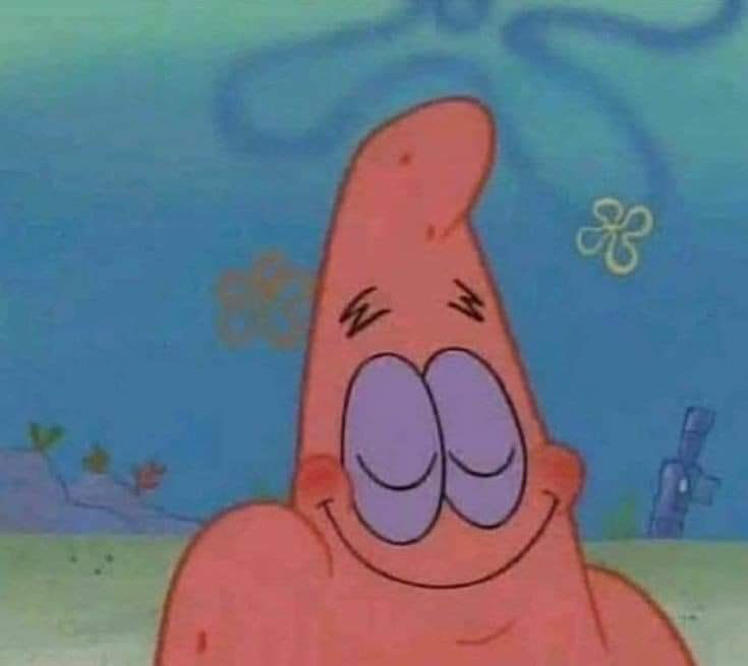 Patrick Star with eyes squinted and a blissfully smug closed smile