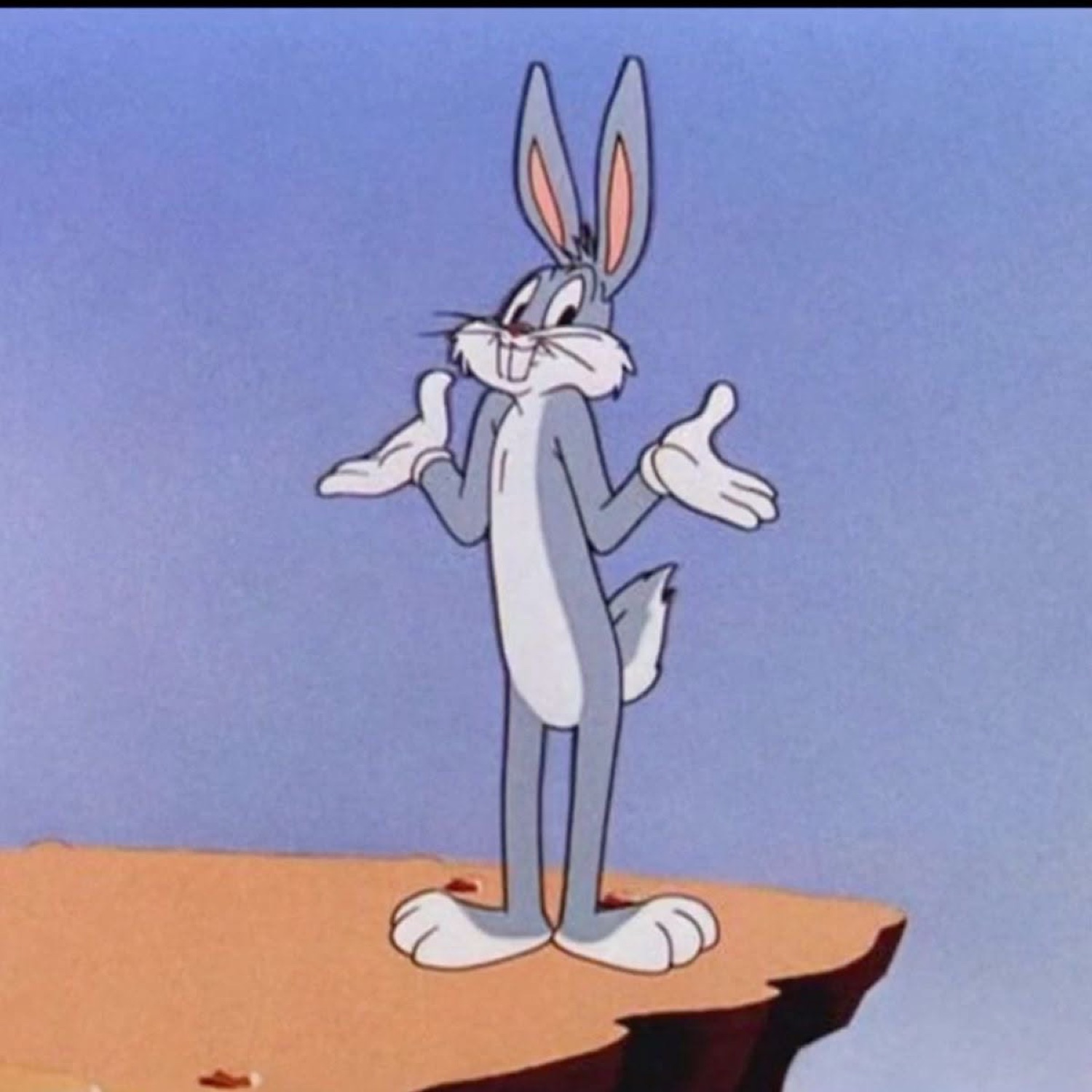 Bugs Bunny standing on a cliff shrugging with both palms up