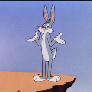 Bugs Bunny standing on a cliff shrugging with both palms up