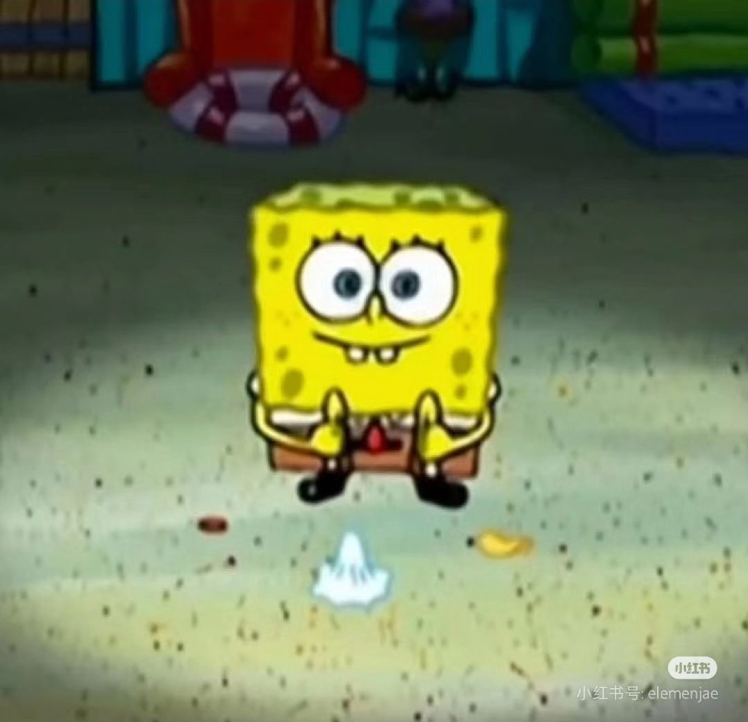 SpongeBob sitting small and hunched with a tense, nervous little smile
