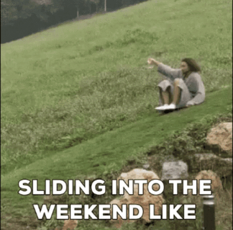 Woman sliding down a grassy hill on her back, "Sliding into the weekend like"