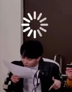 Person reading a paper blankly with a loading spinner graphic over their head