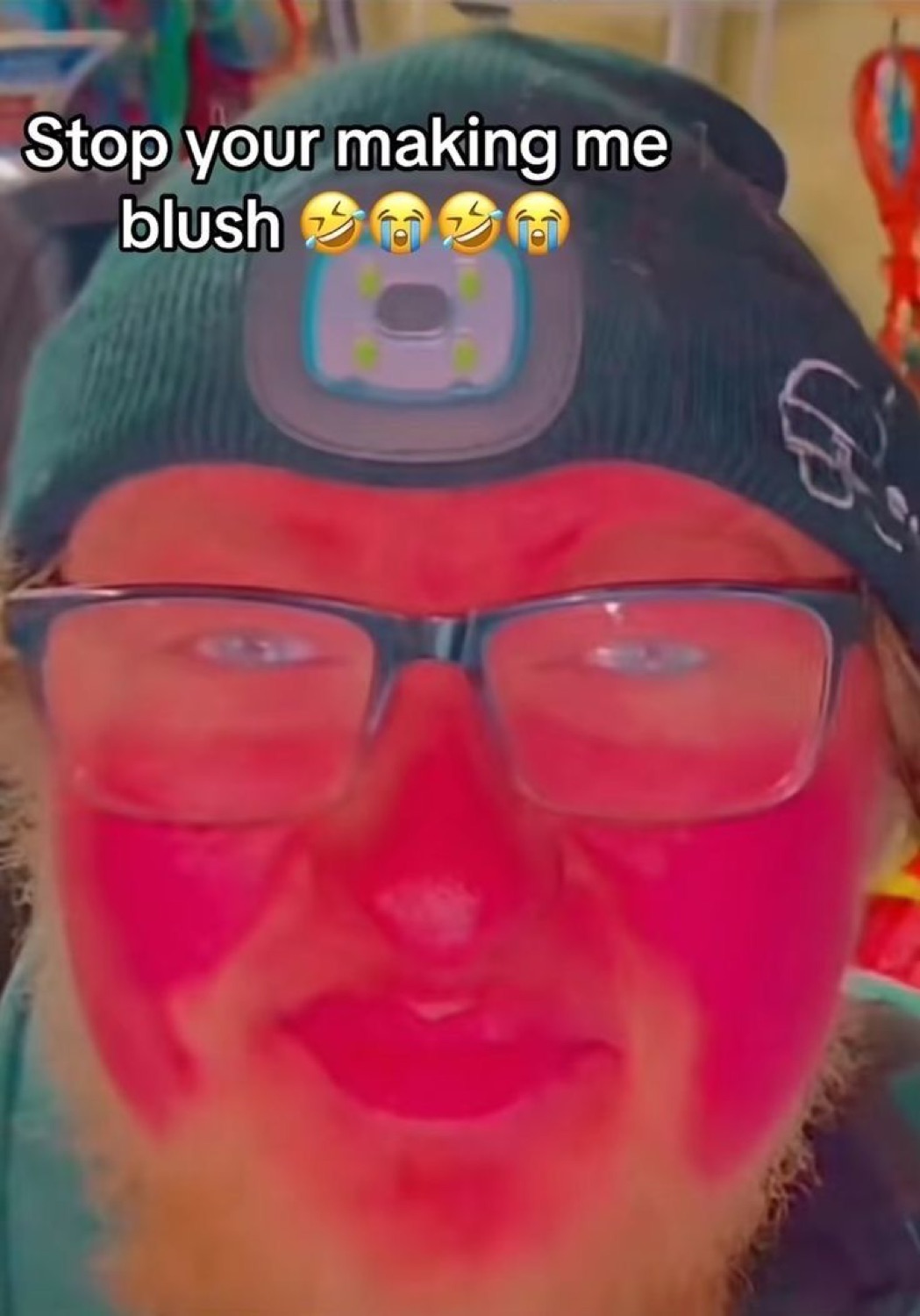 Red-faced bearded man in glasses blushing intensely with text 'Stop your making me blush'