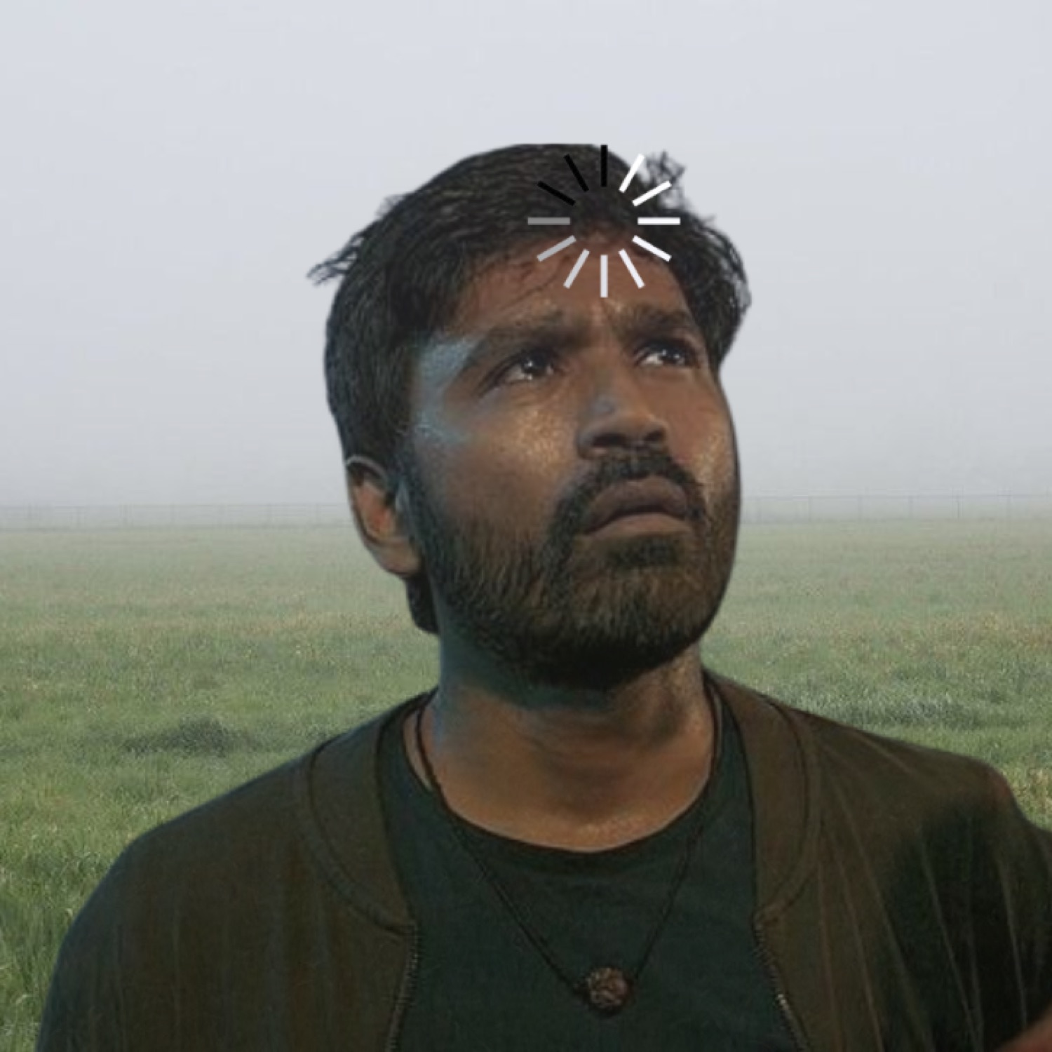 Bearded man gazing up with a loading spinner on his head