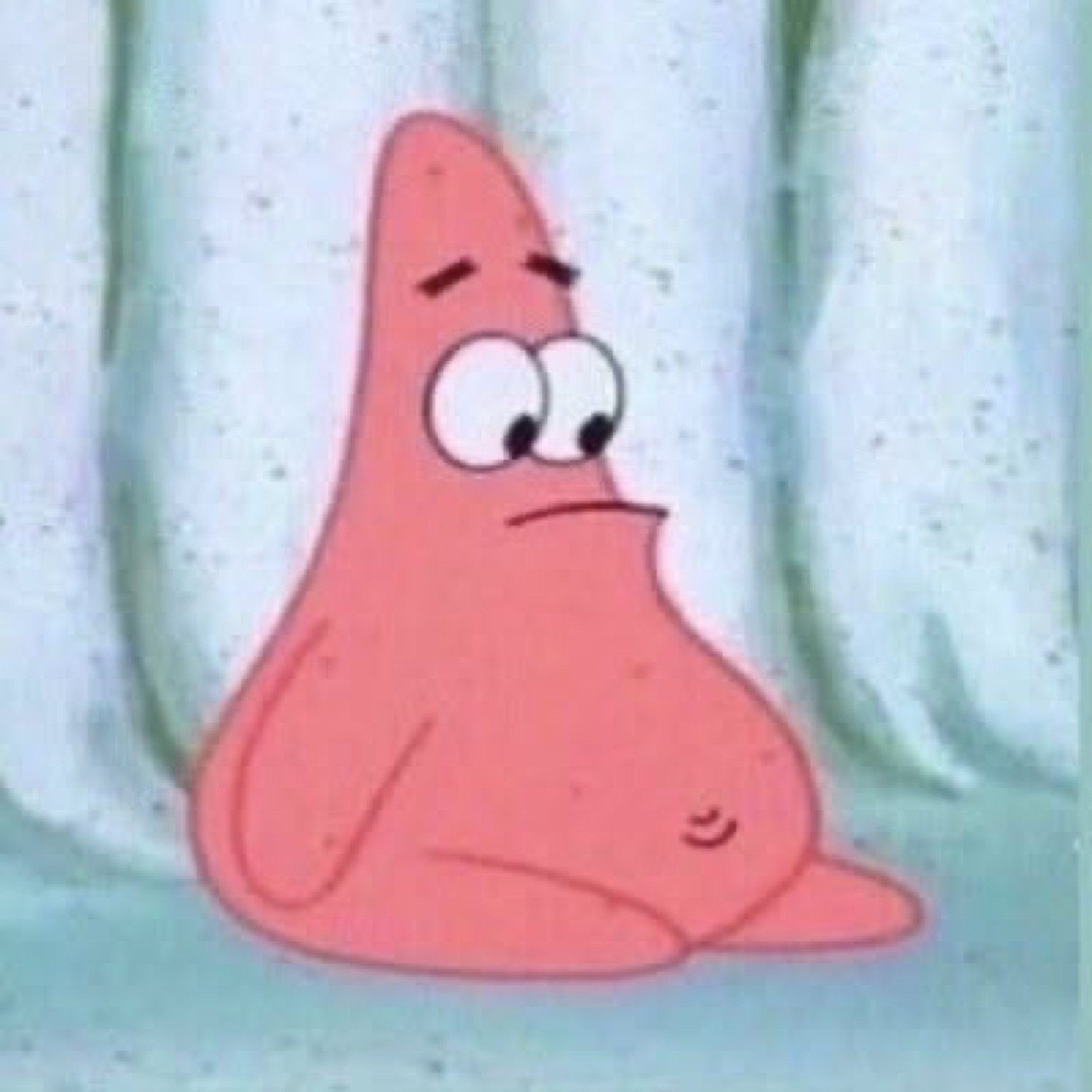 Patrick Star sitting slumped with a tired, vaguely confused frown