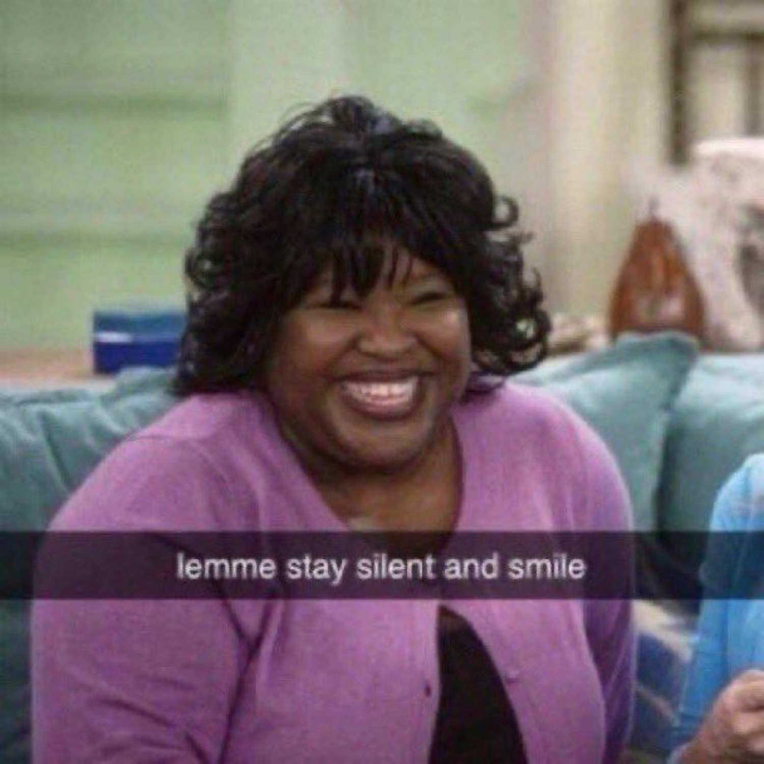 Woman from a TV show beaming with a huge smile, captioned 'lemme stay silent and smile'