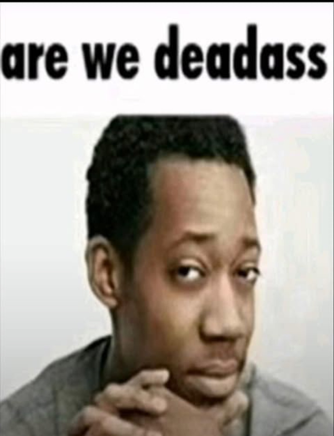 Guy stroking his chin with a skeptical side-eye, captioned 'are we deadass'